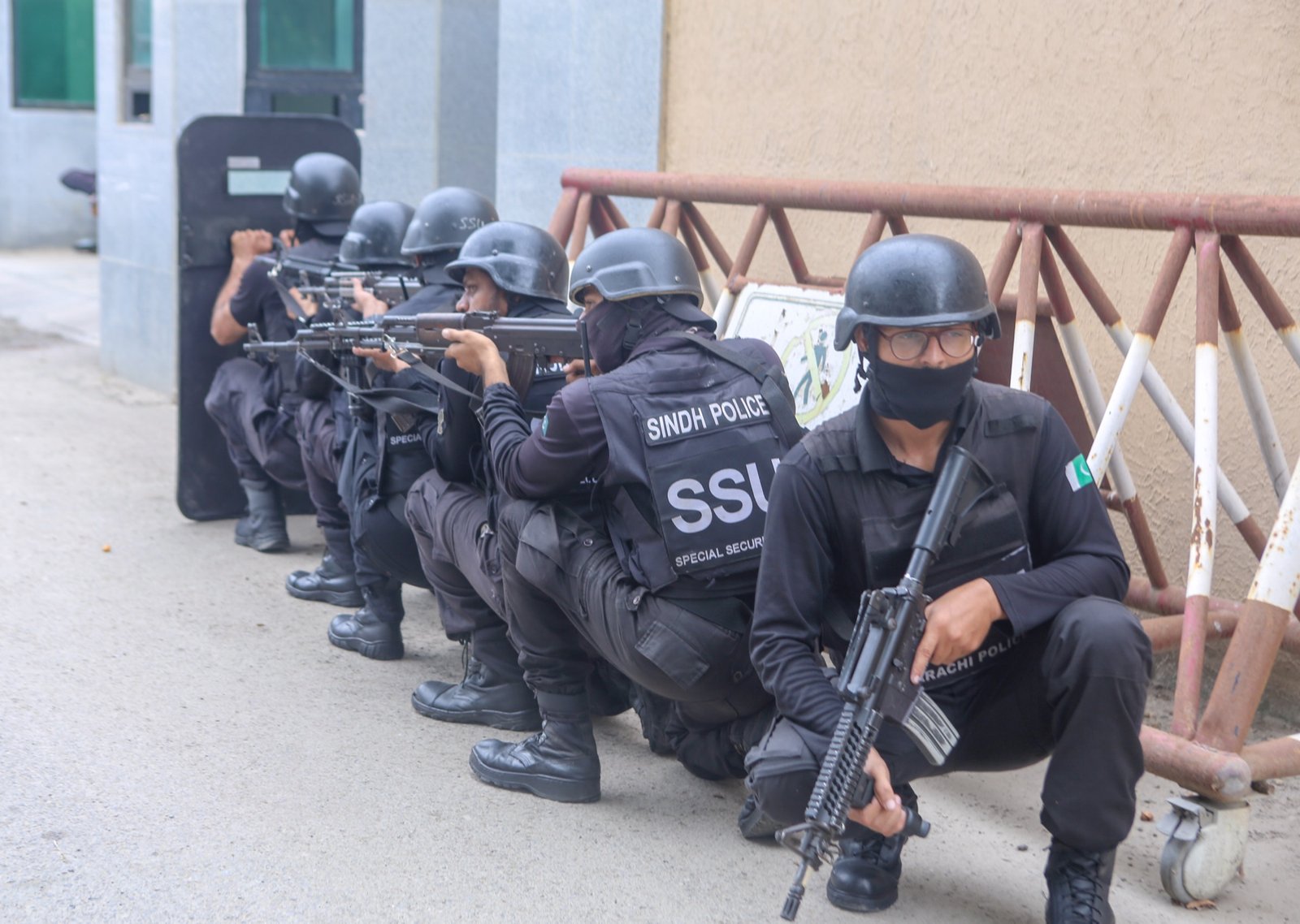 SSU officers in crouched weapons ready line